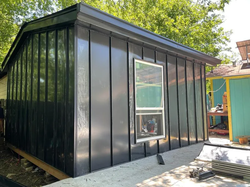 Black standing seam metal wall panels for Roof Inspection in Johnston